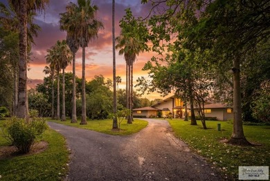 Nestled in the heart of San Benito, this stunning resaca-front - photo 2