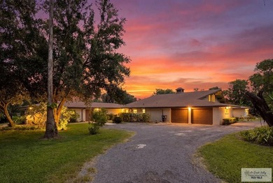Nestled in the heart of San Benito, this stunning resaca-front - photo 3