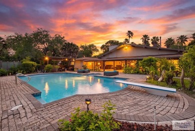 Nestled in the heart of San Benito, this stunning resaca-front - photo 4