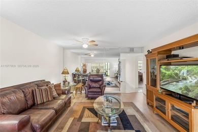 Enjoy spectacular lake and golf course views from this spacious