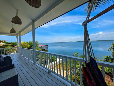 Perched along the tranquil shores of the Placencia Lagoon - photo 34