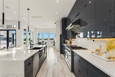 Experience true waterfront luxury in Lakeshore Estates with this - photo 16