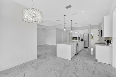 Virtually Staged. Discover luxury coastal living in this - photo 23