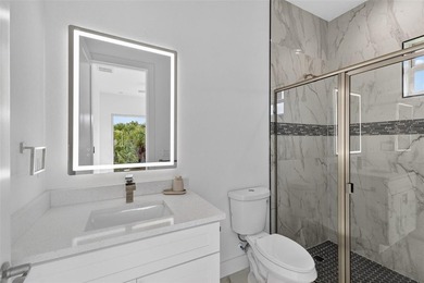 Virtually Staged. Discover luxury coastal living in this - photo 36