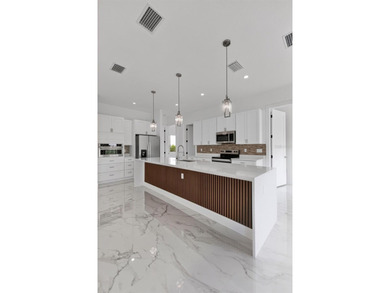 Virtually Staged. Discover luxury coastal living in this - photo 46