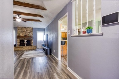 This spacious three-bedroom home features four-sided brick, a - photo 2