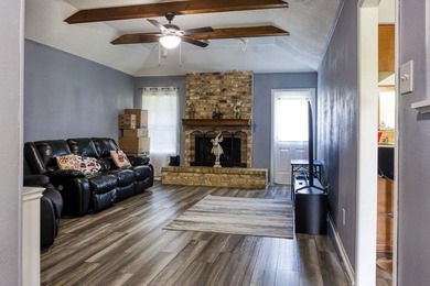 This spacious three-bedroom home features four-sided brick, a - photo 3