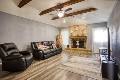 This spacious three-bedroom home features four-sided brick, a - photo 4