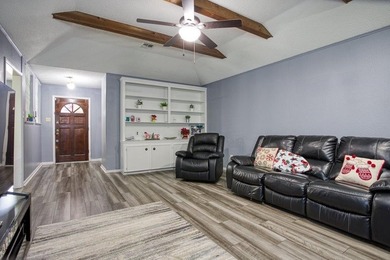 This spacious three-bedroom home features four-sided brick, a - photo 5