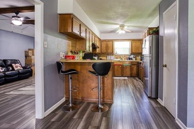 This spacious three-bedroom home features four-sided brick, a - photo 7