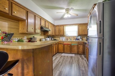 This spacious three-bedroom home features four-sided brick, a - photo 8