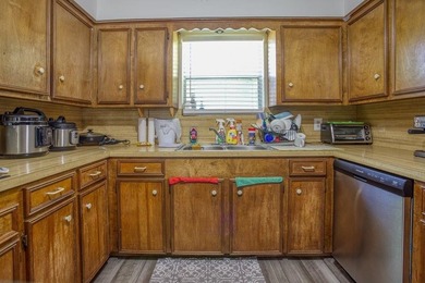 This spacious three-bedroom home features four-sided brick, a - photo 10