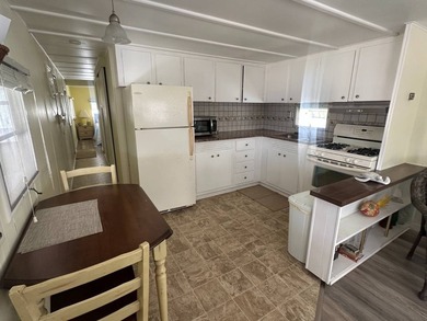 Charming vintage 2-bedroom, 1-bath mobile home located on an - photo 6