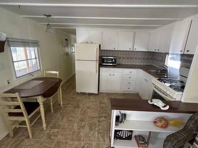 Charming vintage 2-bedroom, 1-bath mobile home located on an - photo 7
