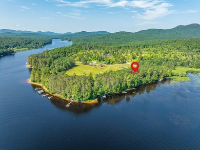 South of the bridge on Long Lake, this waterfront camp sits in a - photo 29