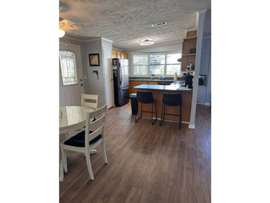 This beautiful 1,494 sq. ft. home is located in a gated 55+ - photo 3
