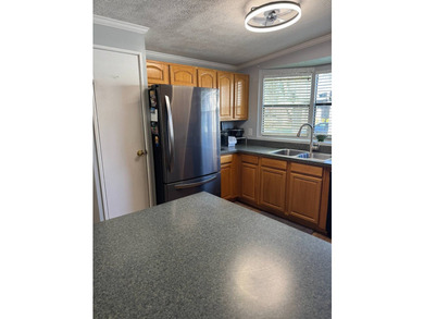 This beautiful 1,494 sq. ft. home is located in a gated 55+ - photo 5