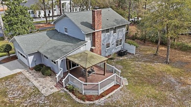Tucked on a quiet cul-de-sac just 2 miles from the beach, this - photo 50