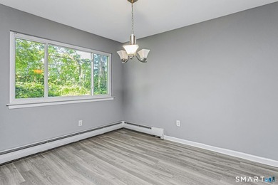 Beautifully updated ground-level ranch style end-unit in - photo 10
