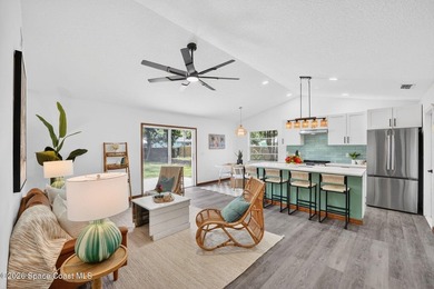 Set on an oversized .46-acre lot with mature trees, this - photo 3