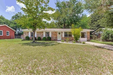 Step into the delightful 3-bedroom, 2-bath haven nestled in the - photo 1