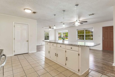 Step into the delightful 3-bedroom, 2-bath haven nestled in the - photo 4