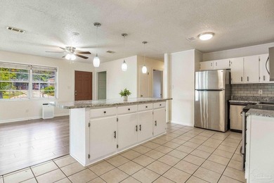 Step into the delightful 3-bedroom, 2-bath haven nestled in the - photo 5