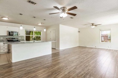 Step into the delightful 3-bedroom, 2-bath haven nestled in the - photo 6