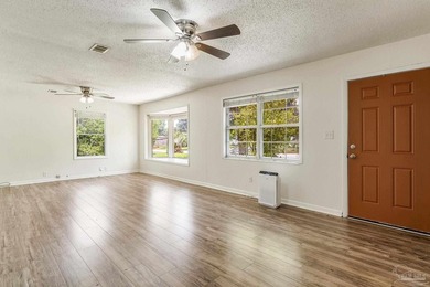 Step into the delightful 3-bedroom, 2-bath haven nestled in the - photo 8