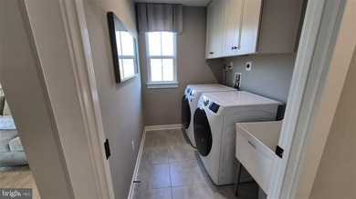 Exquisite Former Model Home with Premium Upgrades & Water Views - photo 25