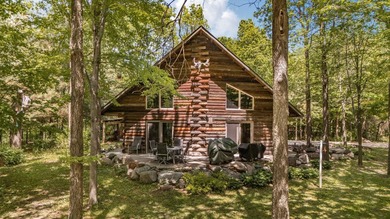 Tucked away on 1.78 private and wooded acres along the majestic - photo 4