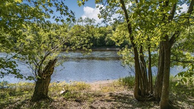 Tucked away on 1.78 private and wooded acres along the majestic - photo 6