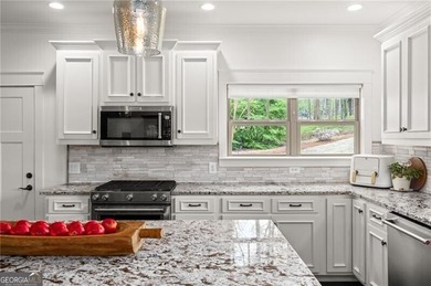 Offered for the first time, this custom-designed home captures - photo 23