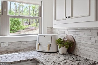 Offered for the first time, this custom-designed home captures - photo 26