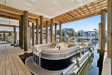 Luxury living on the beautiful Tchefuncte River! 
This stunning