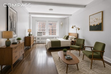 Step into this beautifully renovated pre-war studio in one of - photo 1