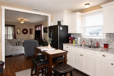 Welcome home to this charming 2-bedroom, 1-bath, detached 1-car - photo 3