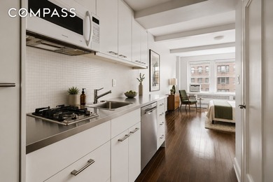Step into this beautifully renovated pre-war studio in one of - photo 4