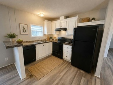 Own your own home in a quiet, well-maintained neighborhood! This - photo 2