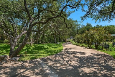 Beyond a gated entrance and beneath a canopy of mature live oaks - photo 3