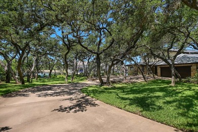 Beyond a gated entrance and beneath a canopy of mature live oaks - photo 4
