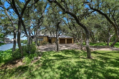 Beyond a gated entrance and beneath a canopy of mature live oaks - photo 5
