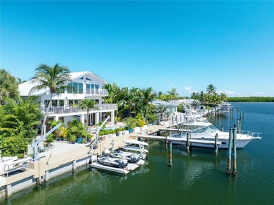 A rare waterfront estate along a 200-foot wide canal with a - photo 6