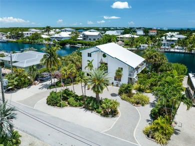 A rare waterfront estate along a 200-foot wide canal with a - photo 7
