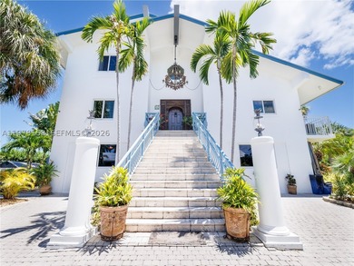 A rare waterfront estate along a 200-foot wide canal with a - photo 8
