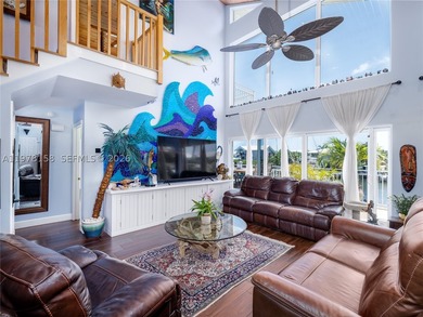 A rare waterfront estate along a 200-foot wide canal with a - photo 9