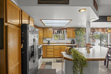 This top floor, three-bedroom, two bath condominium presents the