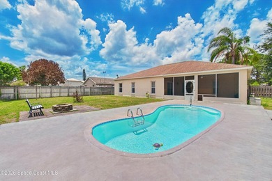 Tucked away in desirable NW Palm Bay, this spacious 3-bed - photo 1
