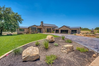 Experience luxury in this stunning new home situated on nearly - photo 1