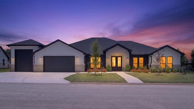 Welcome to this stunning 4-bedroom, 3-bathroom home in the gated - photo 1